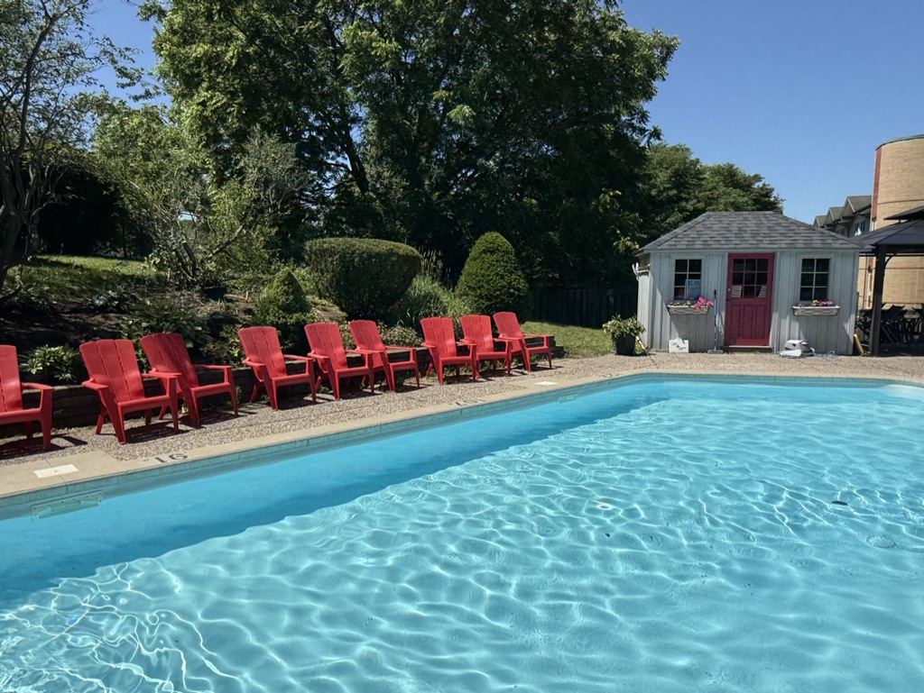 The spacious, well-lit conference room in an office building features a large table and chairs, suitable for meetings. Bro...