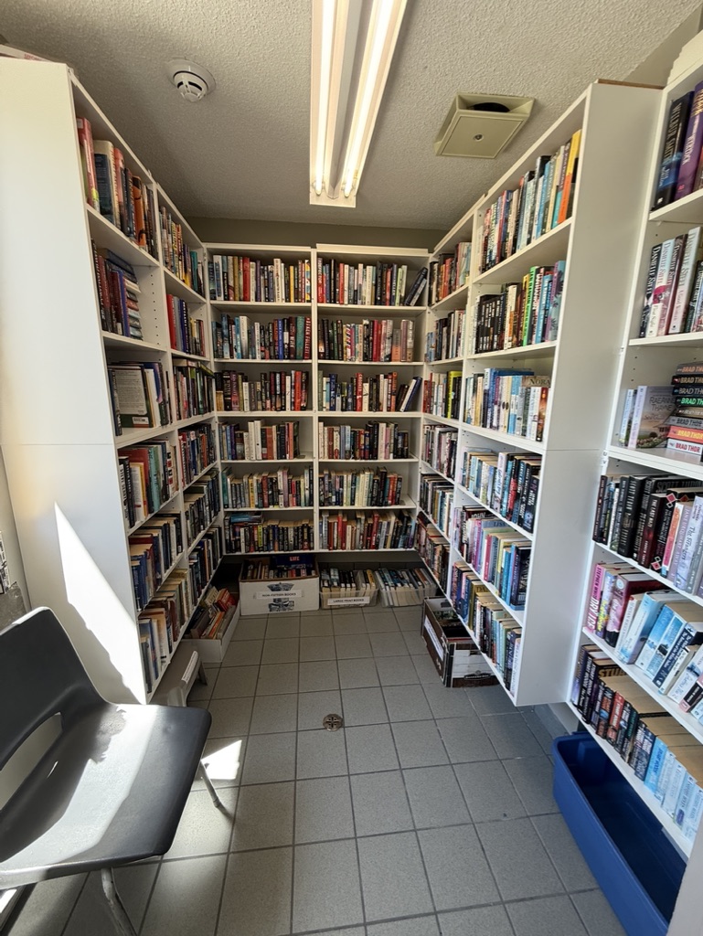 The spacious, well-lit conference room in an office building features a large table and chairs, suitable for meetings. Bro...